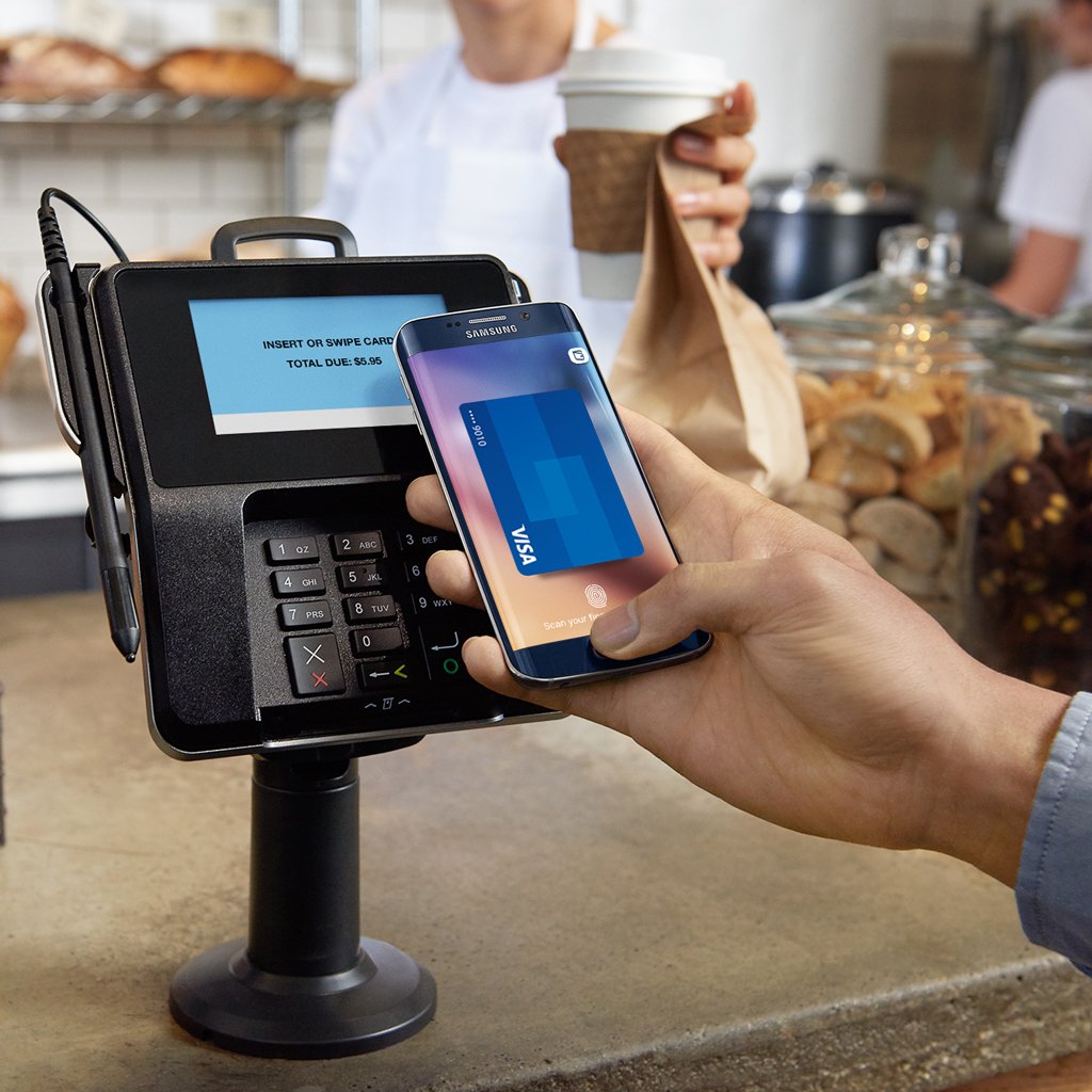 Customer paying using Visa payWave at a wave pay terminal