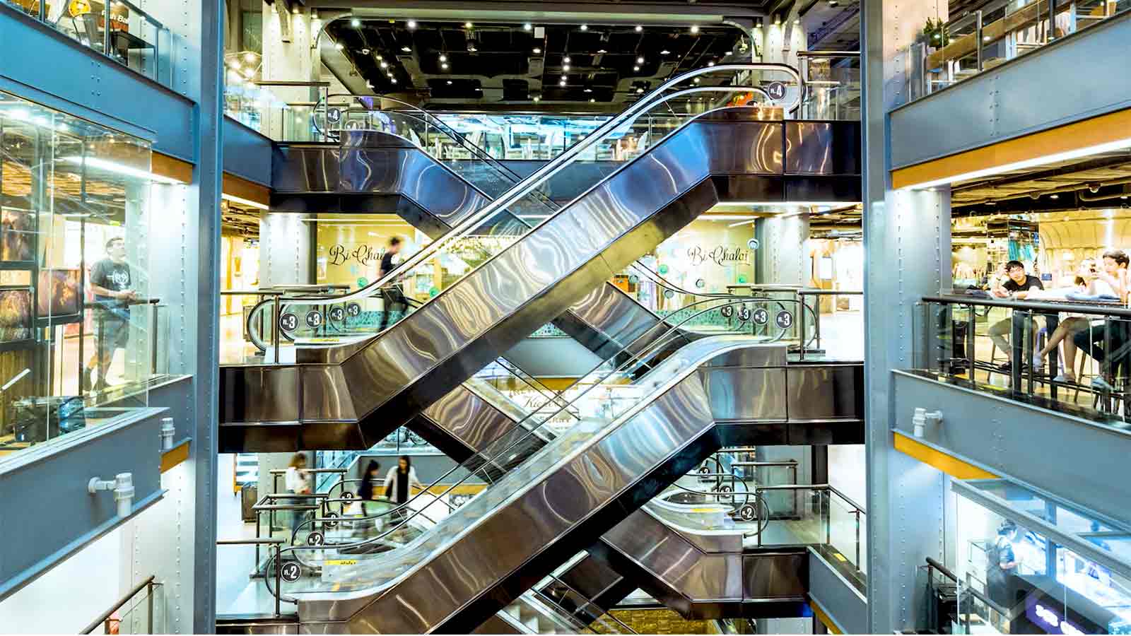 Modern escalators inside a building.