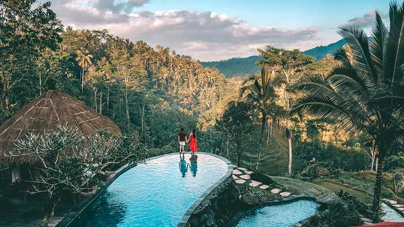 Tourist couple in a beautiful place to visit in Bali